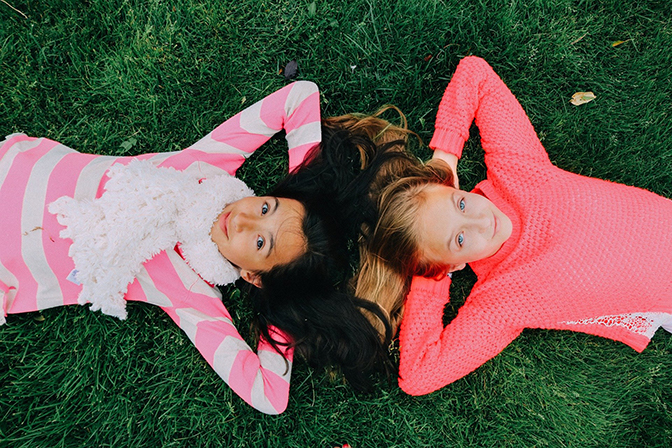 two children playing on grass