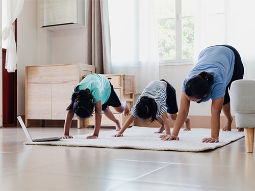 children stretching with mom 