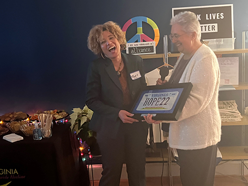 Toni Zollicoffer smiling holding Hope Award