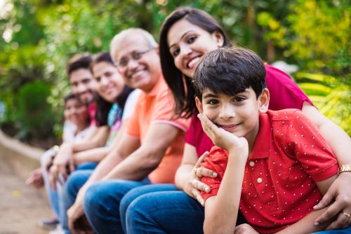 multi-generational family sitting outside
