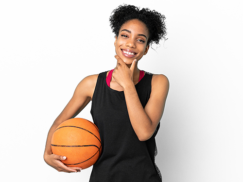 girl holding basketball