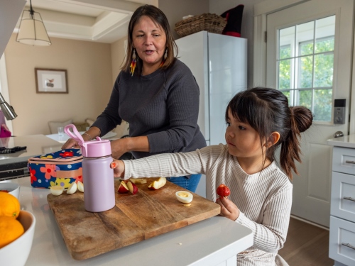mom daughter packing lunch