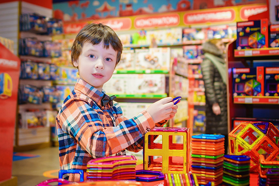 child inside toy store