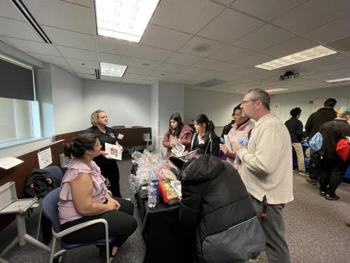 Students visit table to learn about careers.