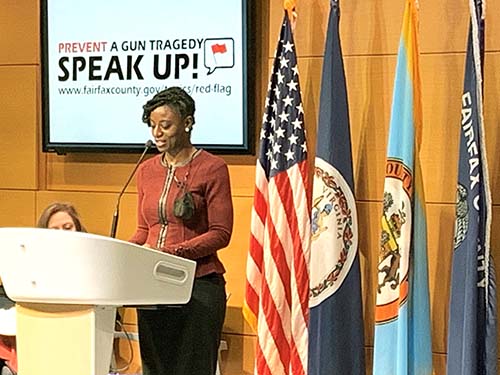 Angela Yeboah standing at podium speaking