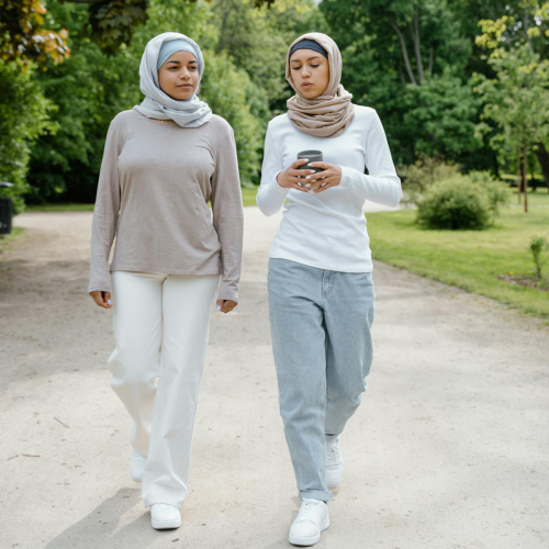 two muslim women walking outside 