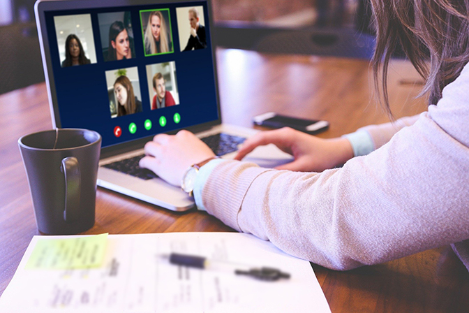 person using computer for virtual group