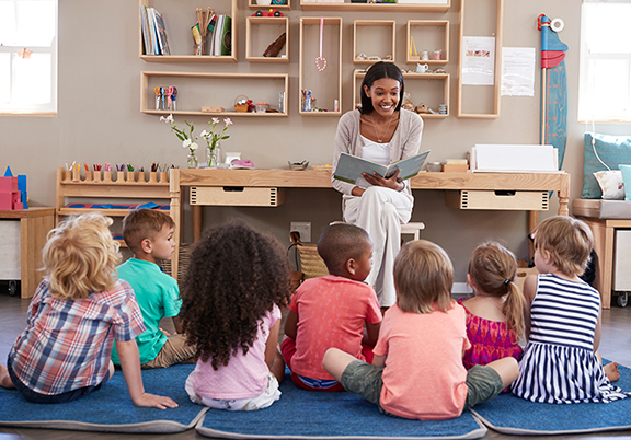 adult reading to young children