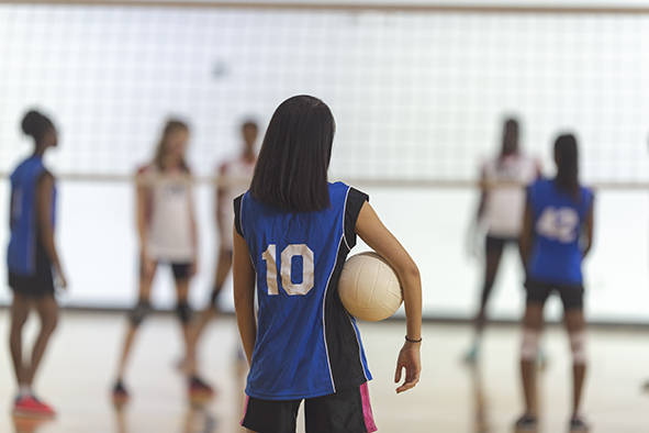 youth playing volleyball