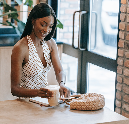 woman sitting at table with coffee