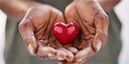 Woman holding heart shape in her hand