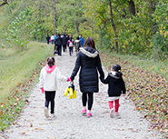 families walking on a trail 