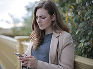 photo of woman looking at her phone