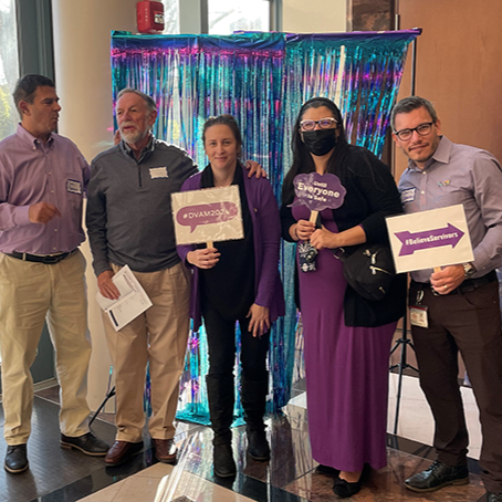Richard Shullaw standing with DSVS employees