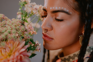 woman smelling fresh flowers