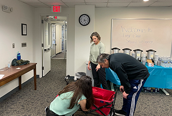 Staff setting up training room