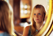 girl looking in mirror