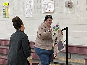 Staff setting up art display