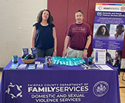 Volunteers Katrina Hush and Vic Batson work the table at Summer Splash event