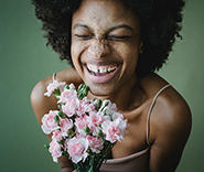 woman smiling with flowers