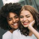 two women hugging 