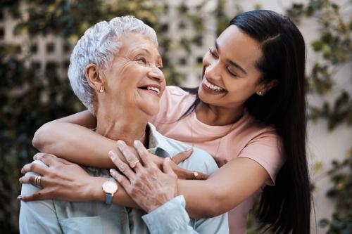 two women hugging 