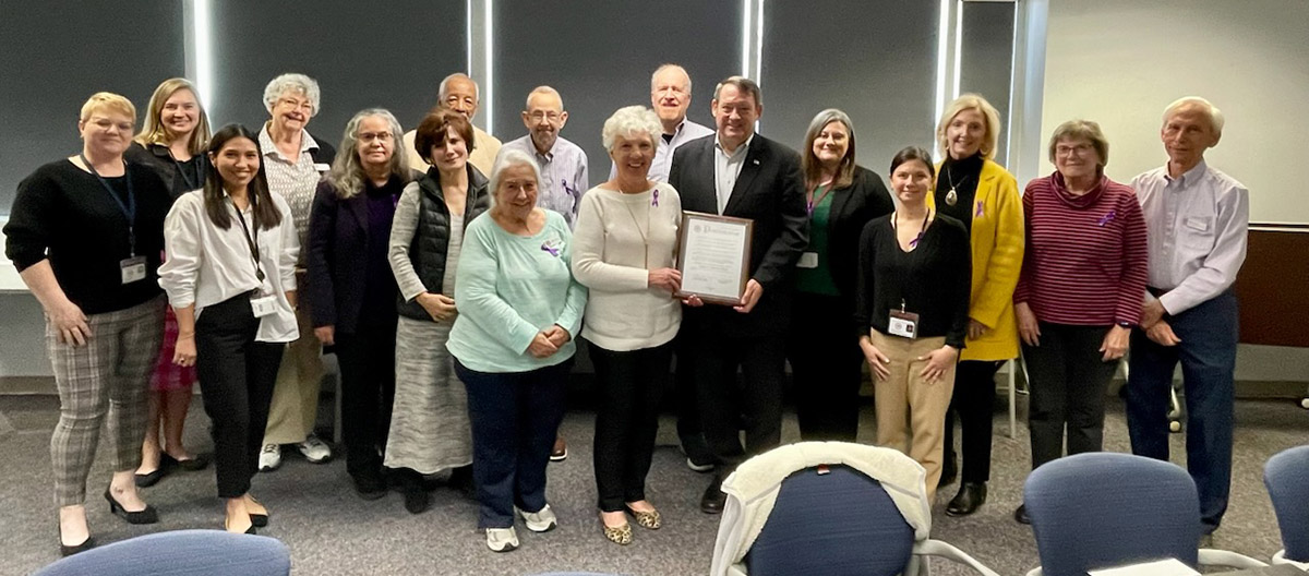 Photo of Supervisor Pat Herrity and the Fairfax County Commission on Aging members with the 2023 proclamation declaring November as Caregivers Awareness Month. 