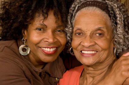 older adult and their parent smiling