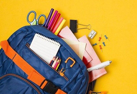 backpack with school supplies spilling out