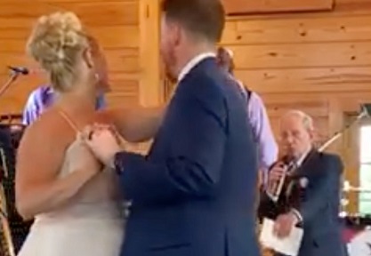 Dick Orndoff singing to wedding couple