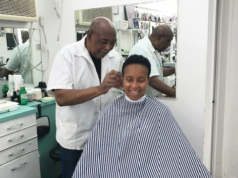 Herman "Smitty" Smith cutting Jennifer Turner's hair