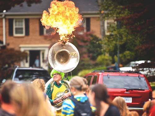 Jay Converse and tuba with fire coming out of top of tuba