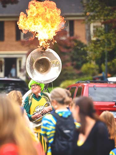 Jay Converse and tuba with fire coming out of top of tuba