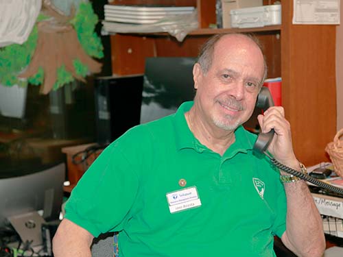 José Acosta using telephone