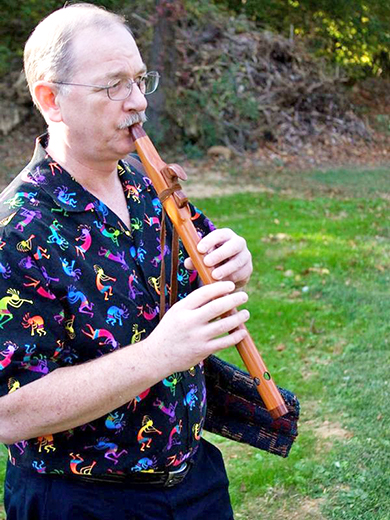 Stuart Hill outside playing instrument