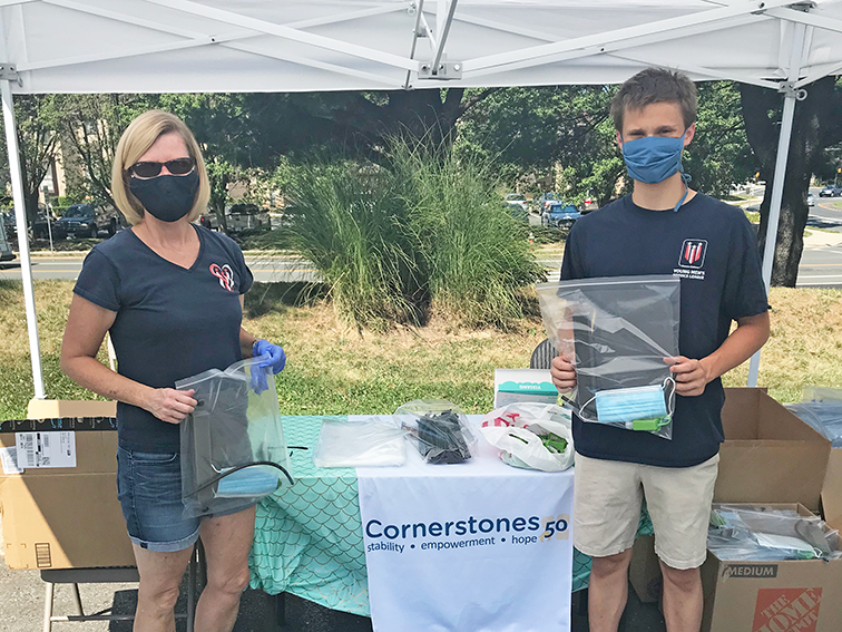 Tina and Nick Matsukas at Cornerstones tent booth handing out PPE