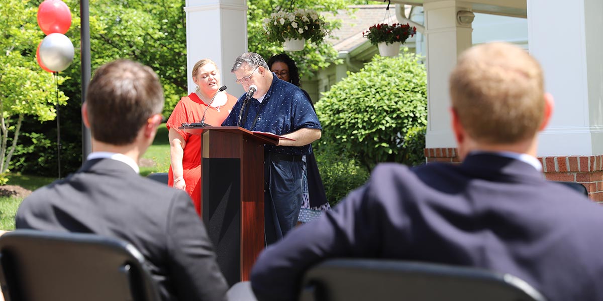 Photo of Wellness Center participant Tom Deeley speaking at the ribbon-cutting event.