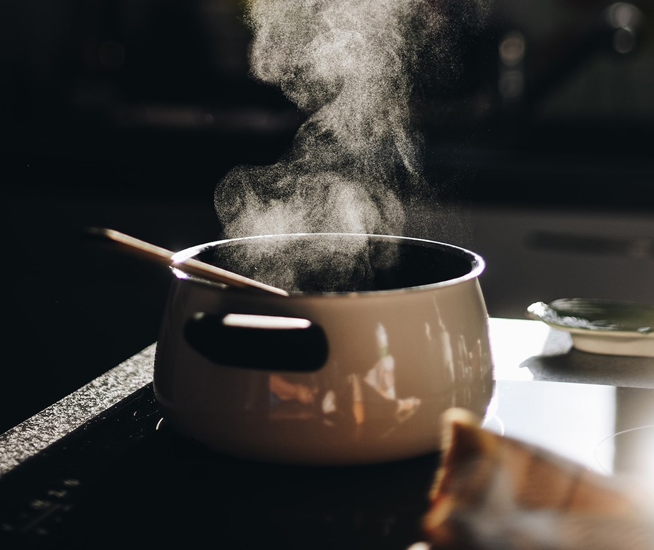Photo of a steaming pot on a stovetop