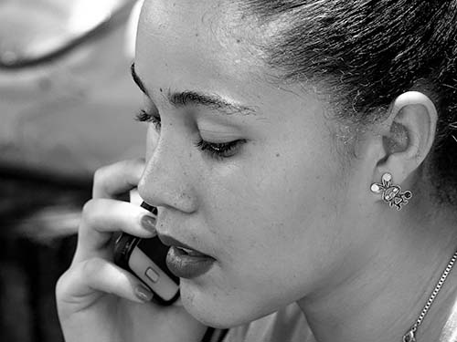 person talking on phone, black and white photo