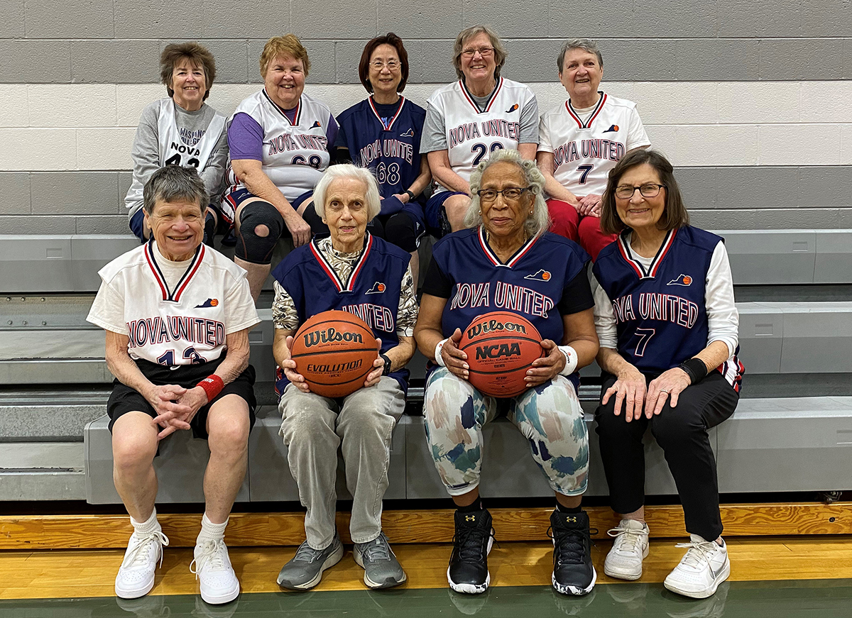 A photo of eight NOVA United Senior Women's Basketball Association players sitting on bleachers.