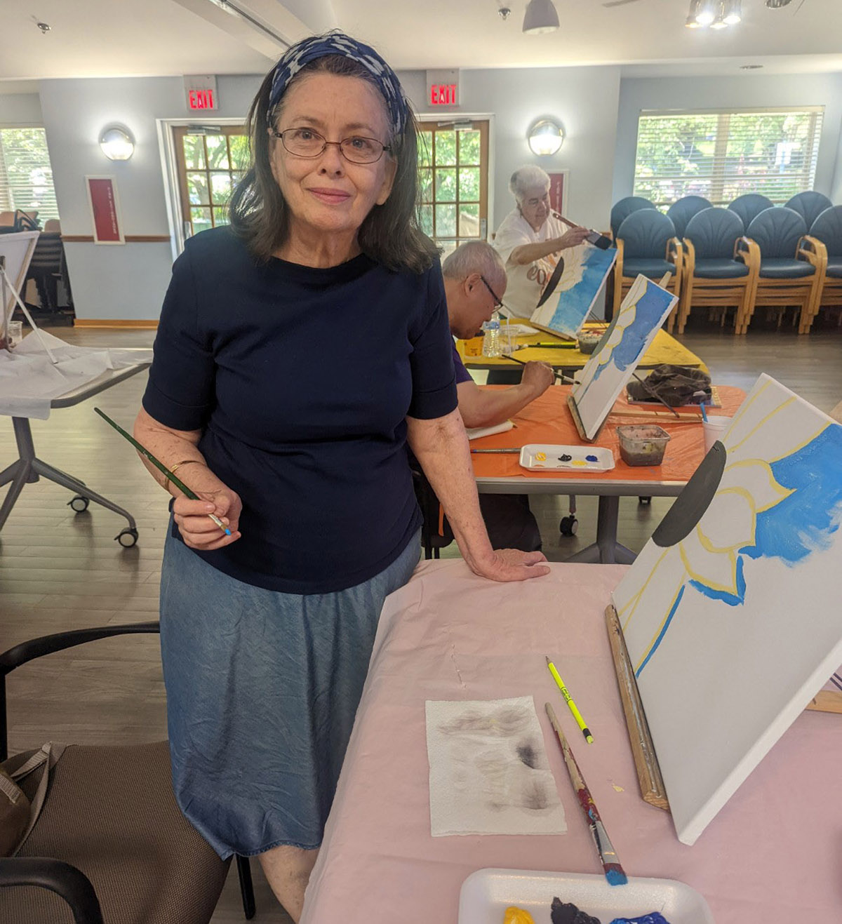 Photo of senior center participants enjoying a painting class at Little River Glen Senior Center.