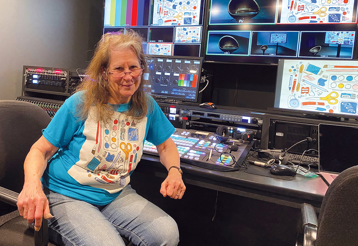 Gail Ruf in a TV studio at Fairfax Public Access.