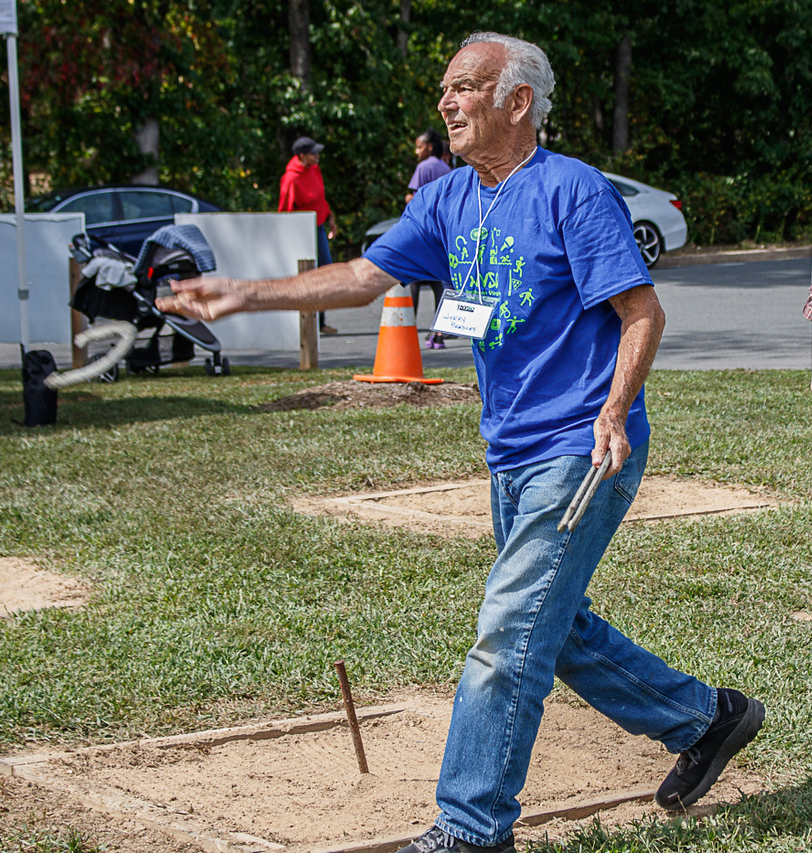 Photo of Jerry Bradley throwing a horseshoe in competition at the 2023 NVSO games.