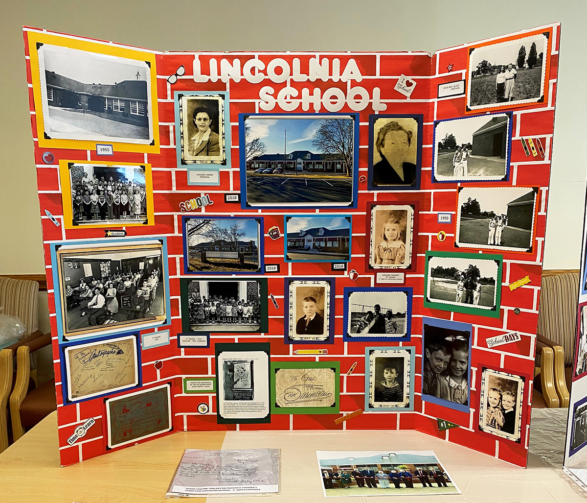 Photo of the display board about the Lincolnia School that includes photos and captions. 