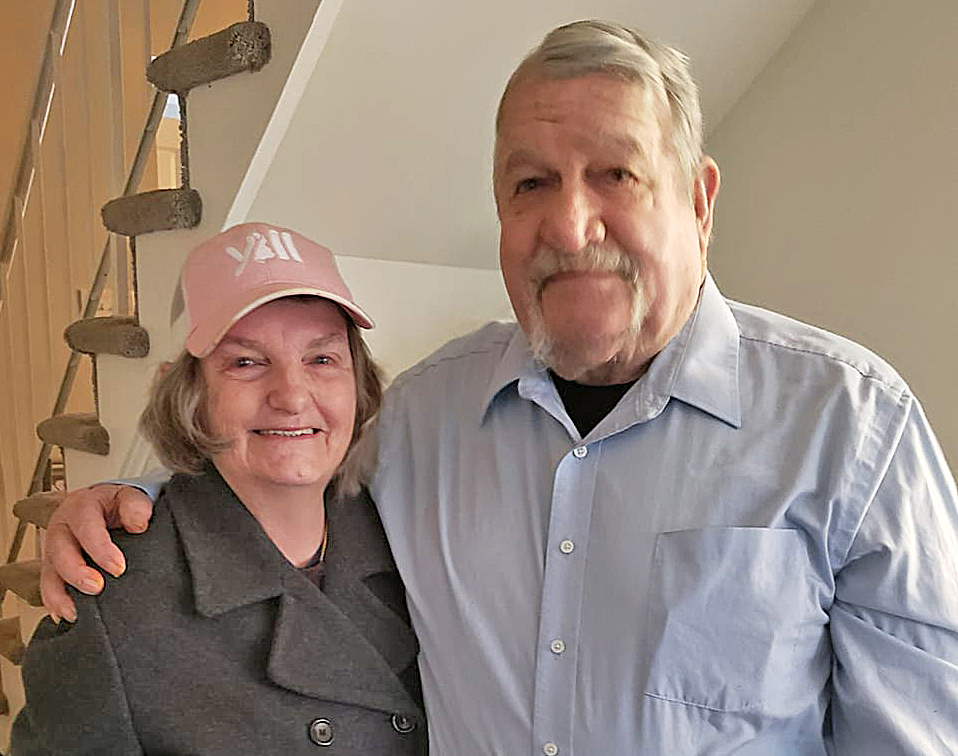 Photo of Mike and Susan Keel standing together and smiling. 