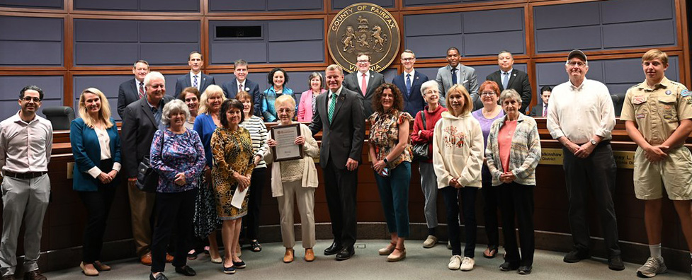 Fairfax Board of Supervisors present Elaine Miletta a plaque in recognition of her animal welfare work. 