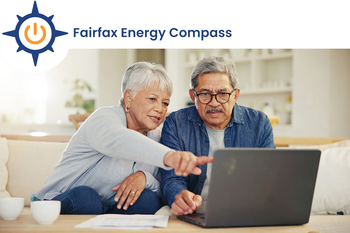 Fairfax Energy Compass logo superimposed on a photo of an older couple looking at a laptop while seated on a sofa.