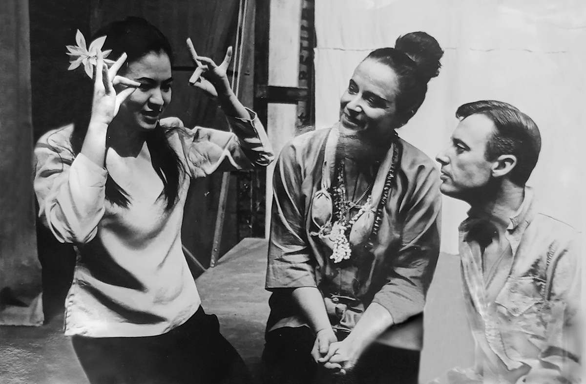 Black and white photo of Fidelita Levy and two other lead actors from "South Pacific" seated together and talking.