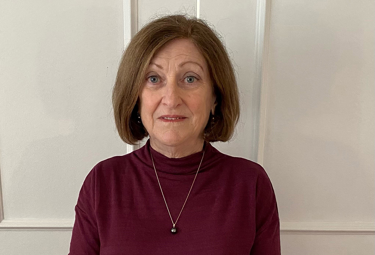 Photo of Teresa Barry wearing a burgundy sweater.