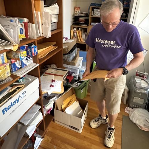 man sorting papers